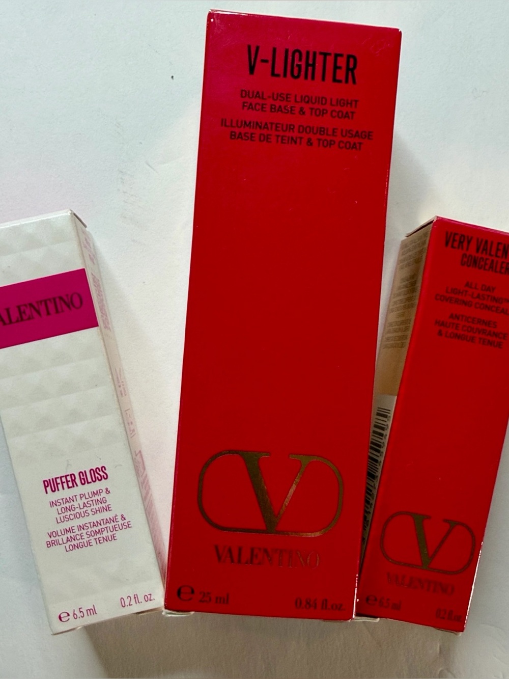 Valentino Bundle V-Lighter, Puffer Gloss, and Very Valentino Concealer.